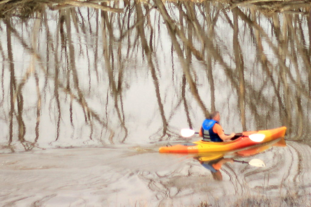 Tight crop of the kayaker on the river
