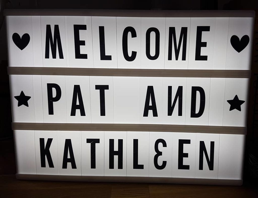 Sign reading MELCOME PAT AND KATHLEEN