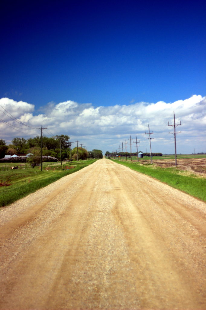 Country road and prairie sky