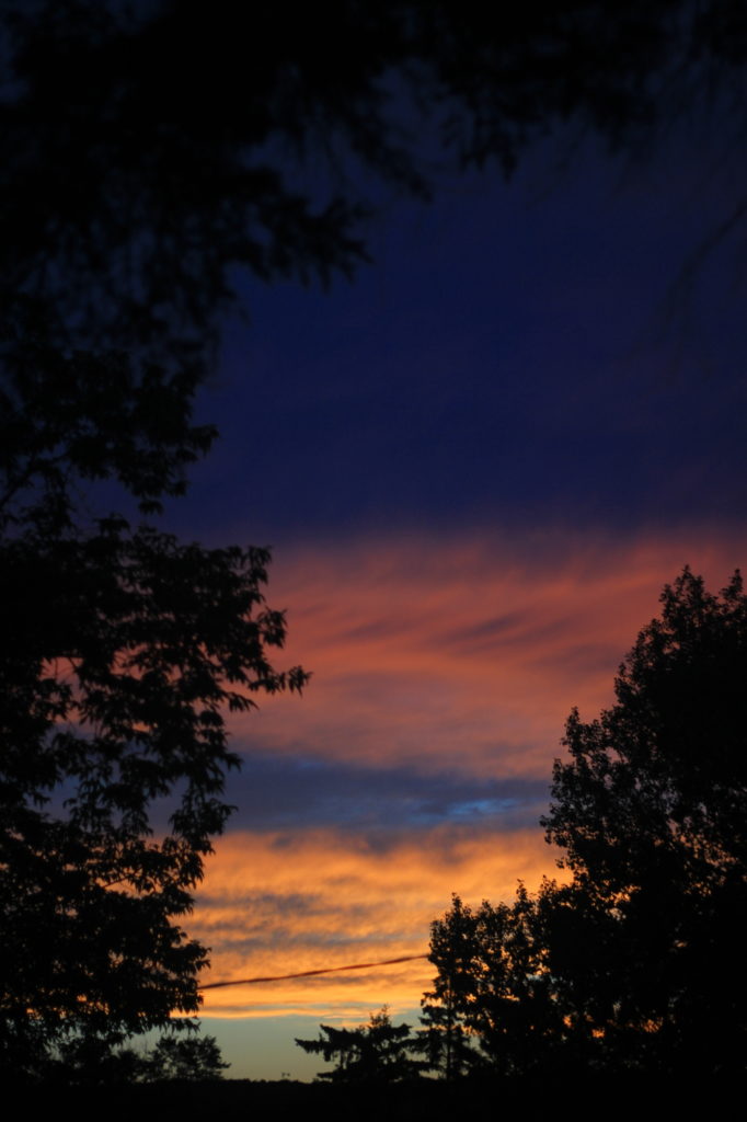 Sunset with clouds: blue, orange, pink, and indigo