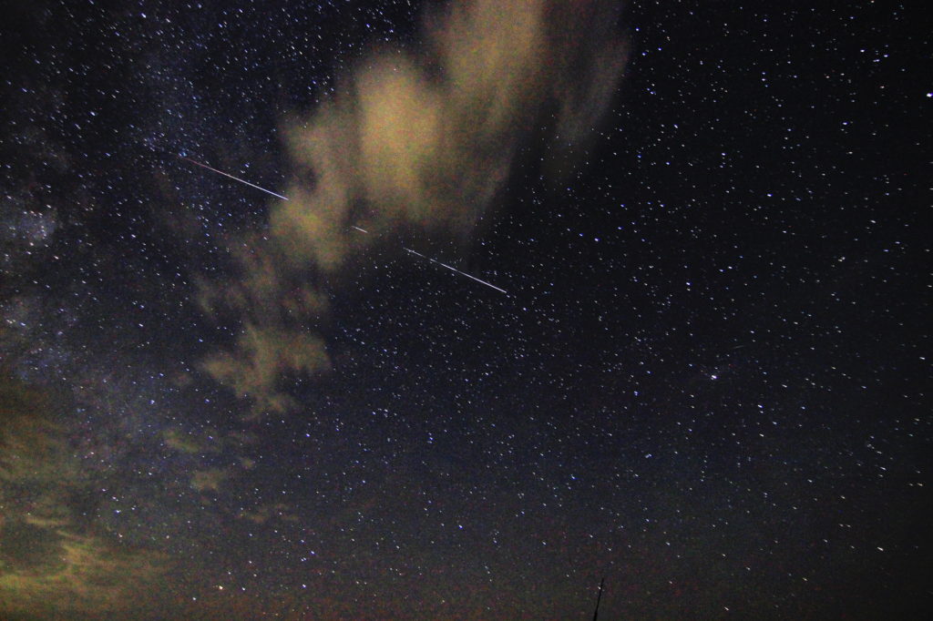 The International Space Station ducks behind a cloud