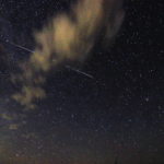 The International Space Station ducks behind a cloud