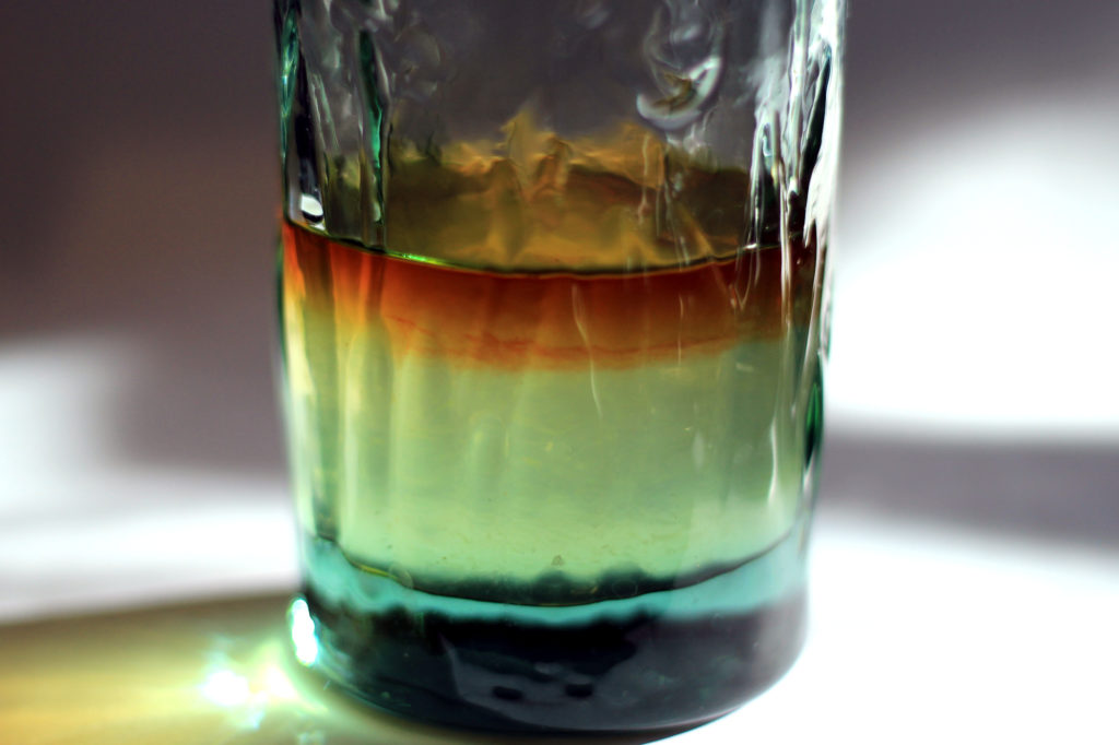Rum floating on lemonade syrup