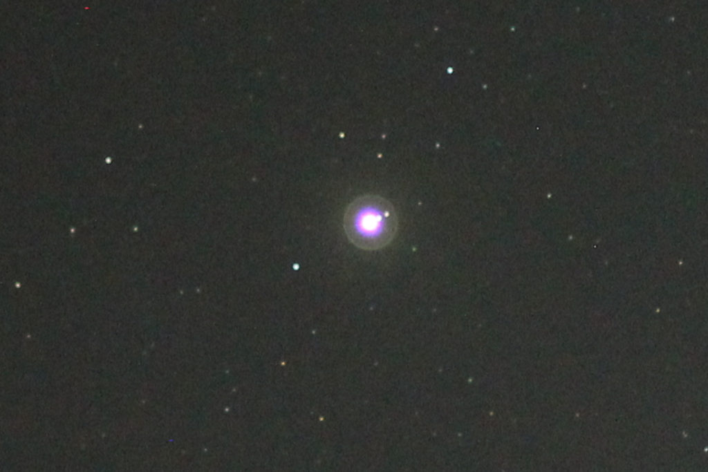 Jupiter, with (I think) Europa, Ganymede, and Callisto visible