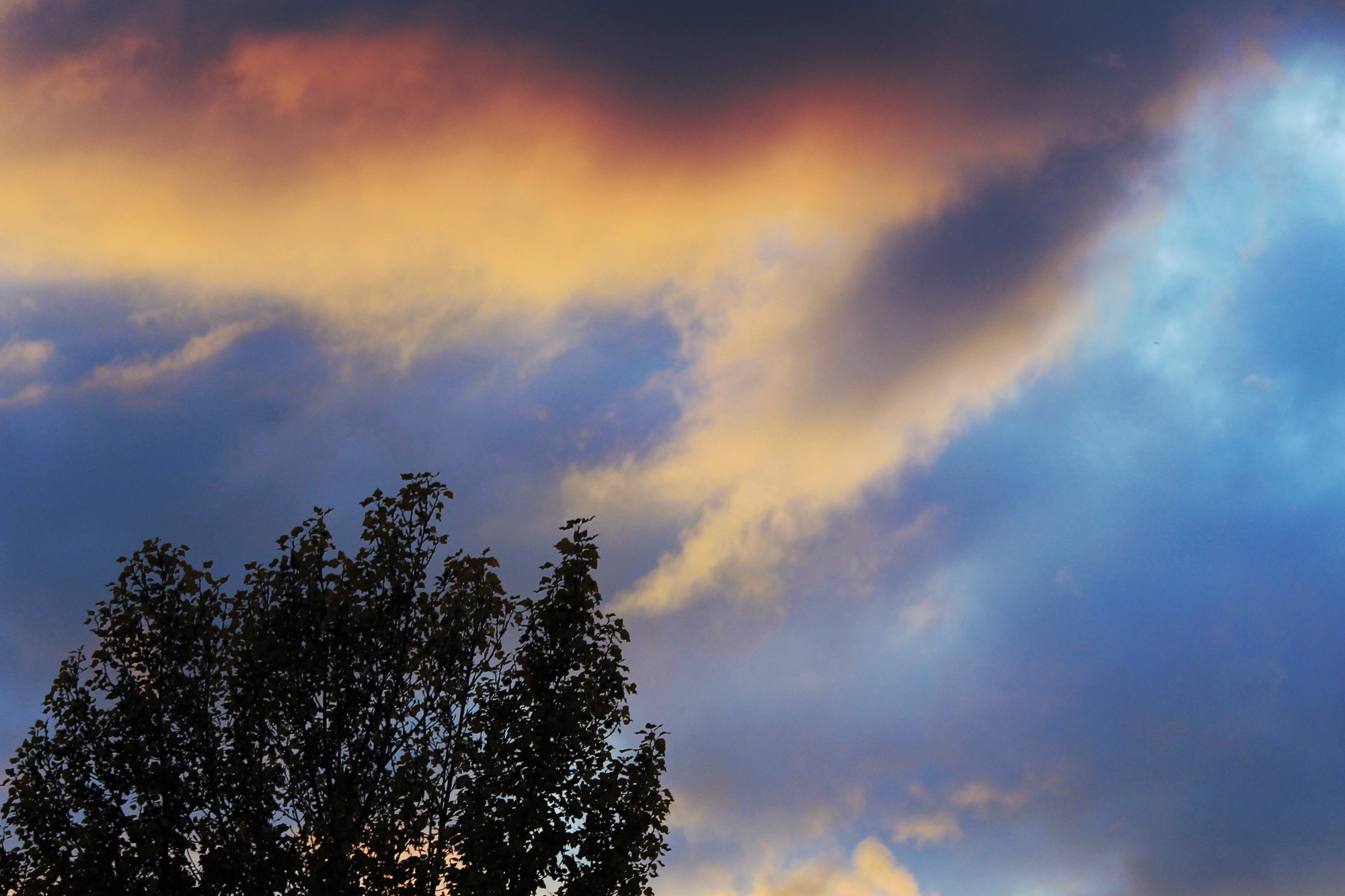 Sunset clouds, orange against dark blue