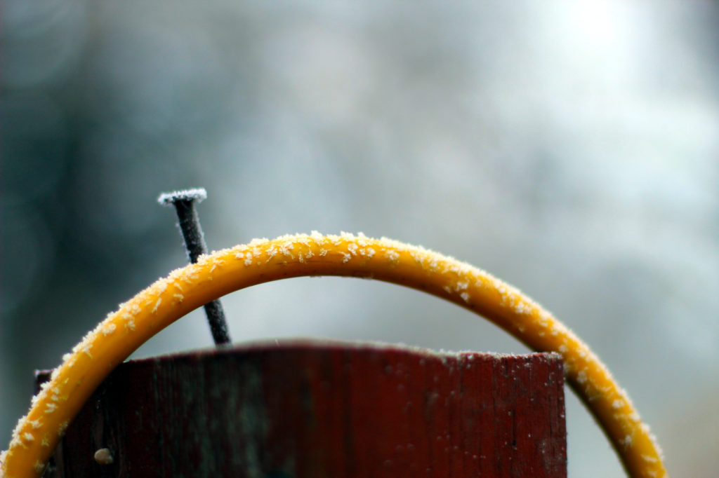 Rime ice / hoarfrost on a yellow extension cord