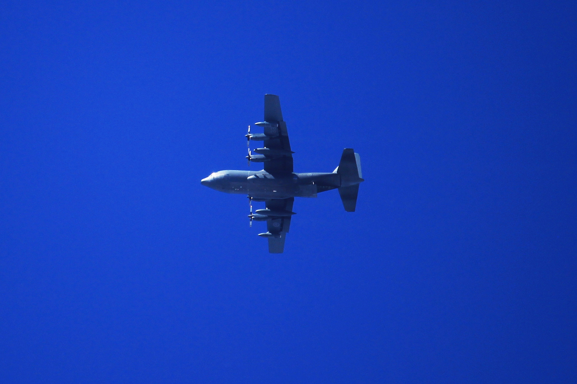 A C-130 Hercules high in the sky