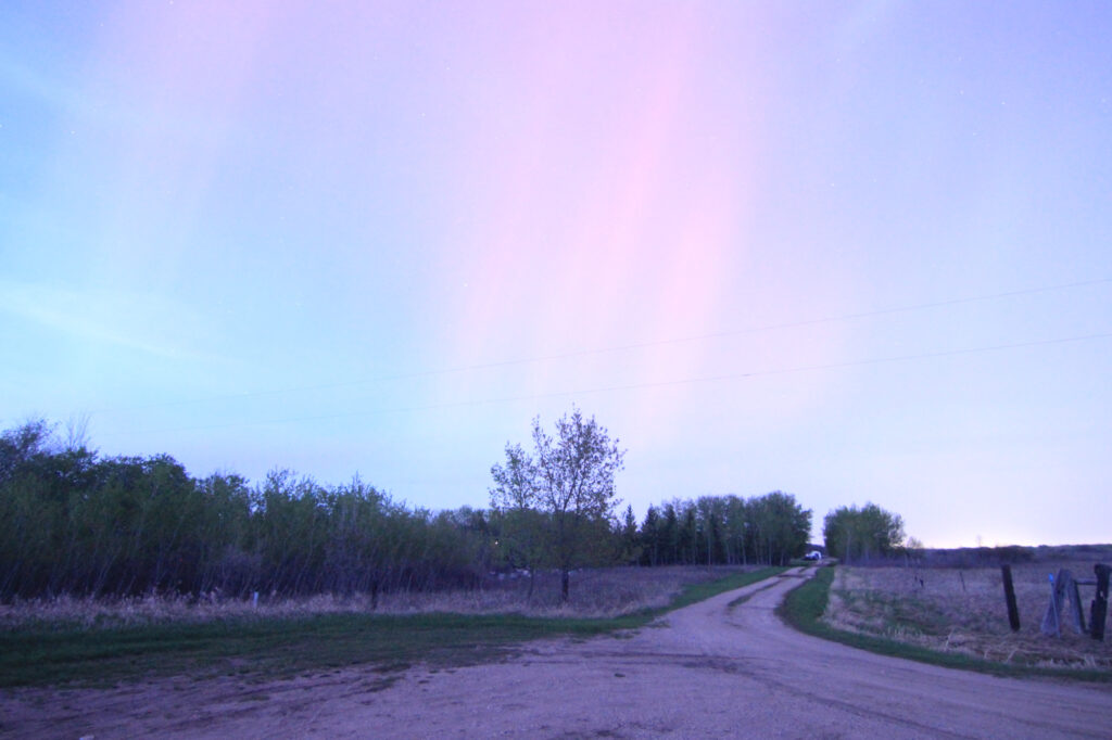 Aurora Borealis - faintly visible against the still-bright sky, not long after sunset