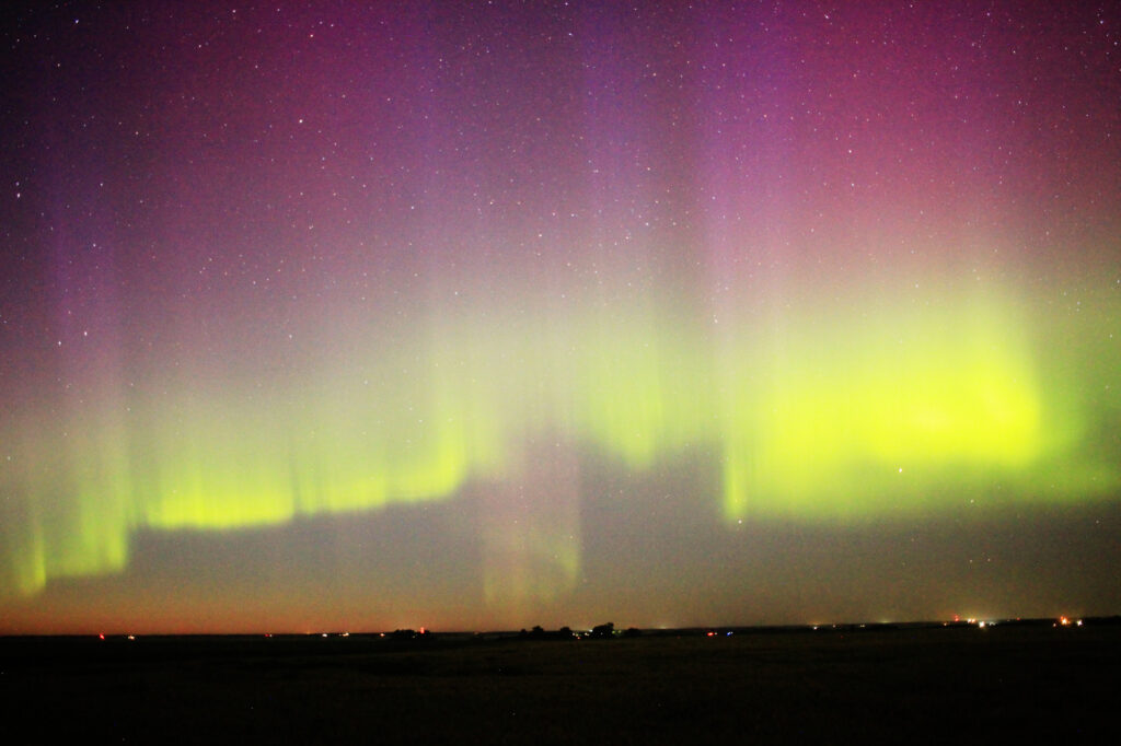 Aurora Borealis: vivid purple pillars above a green band