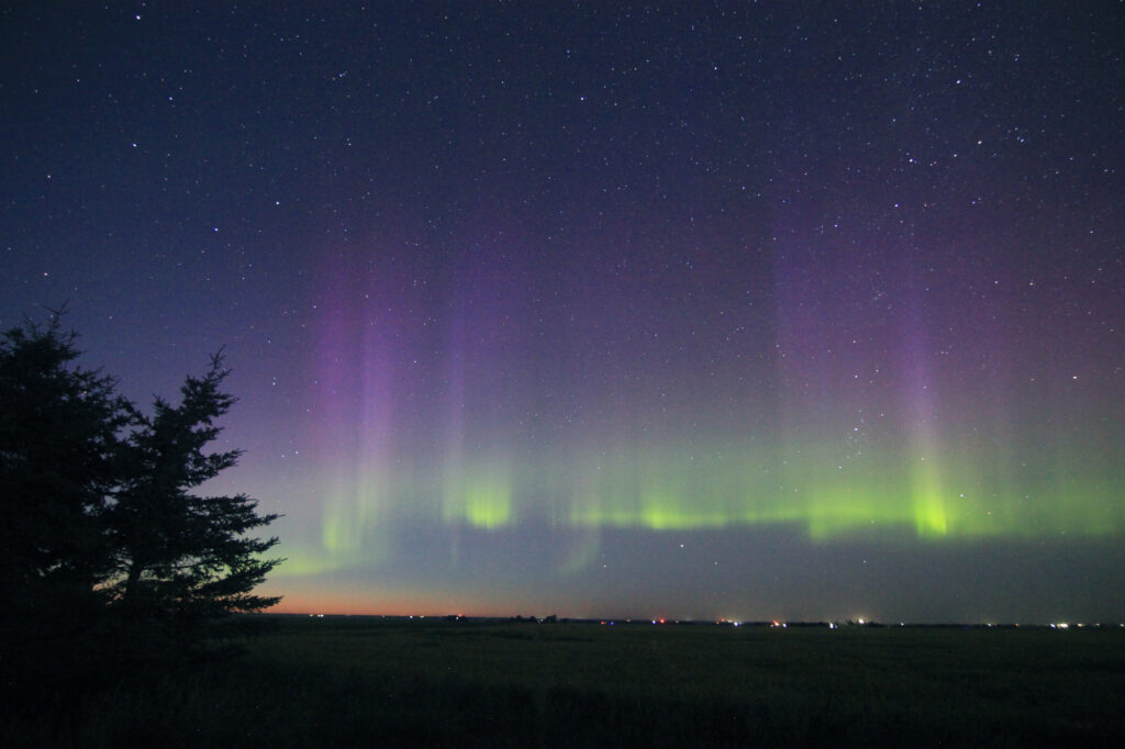 Aurora Borealis: purple pillars above a thin green band