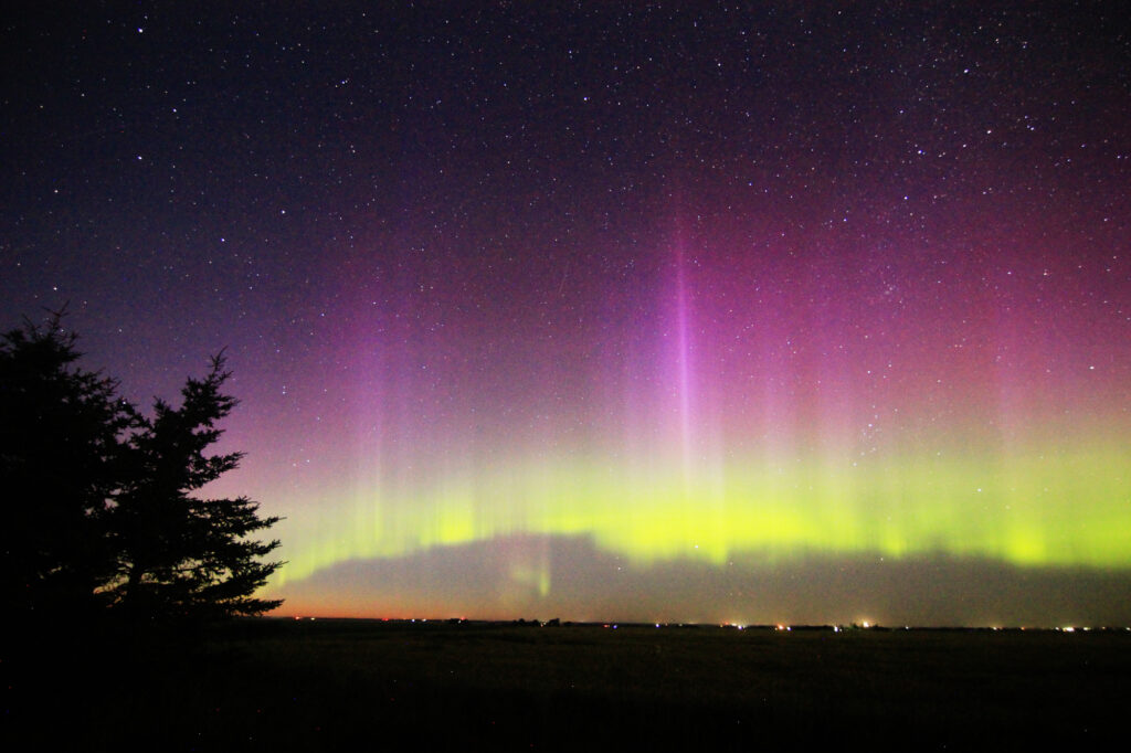Aurora Borealis: vivid purple pillars above a green band