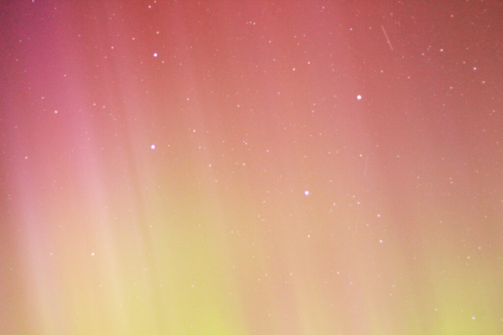 Aurora Borealis: mostly soft purple with a bit of green at the bottom