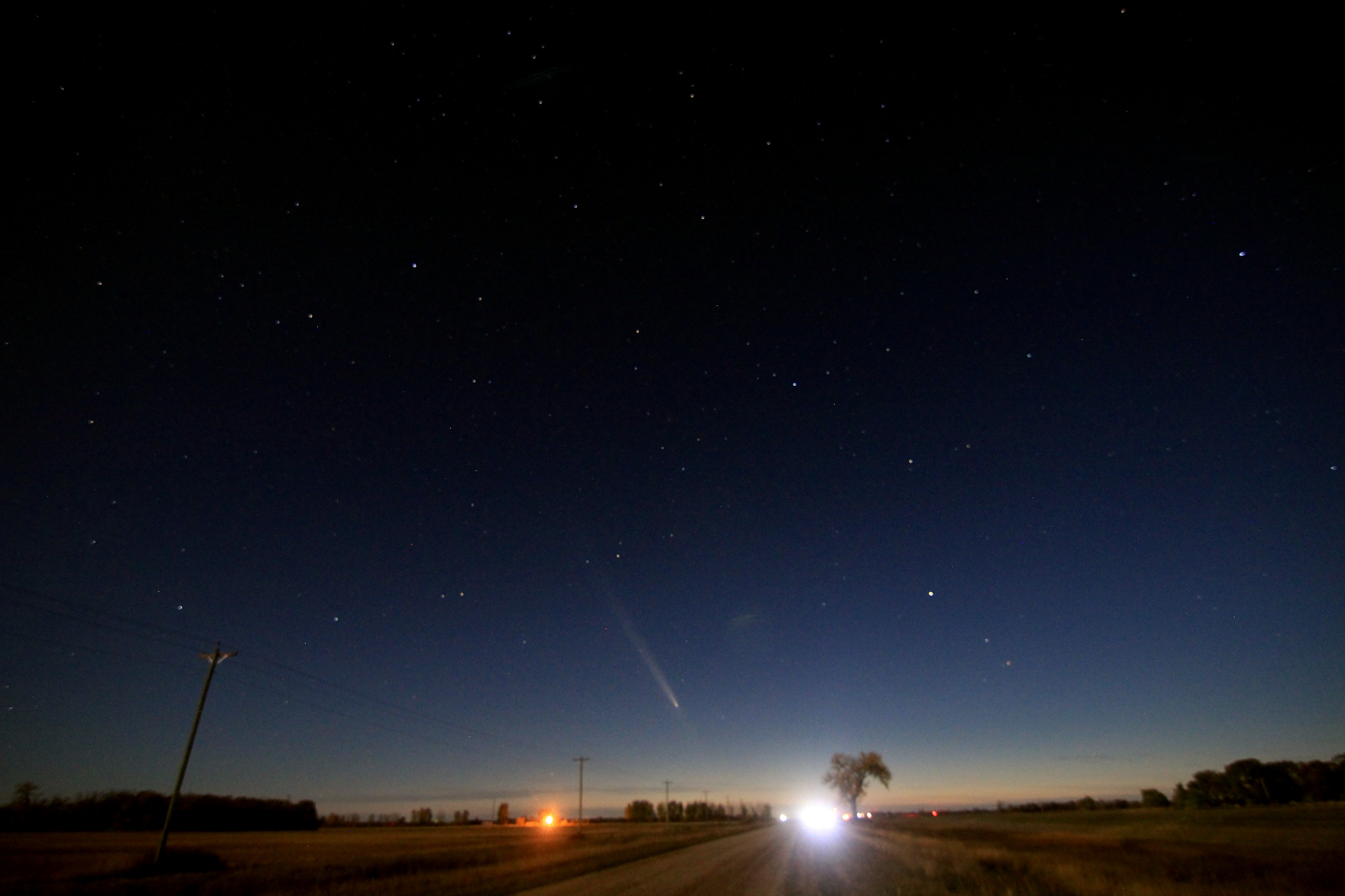 The night sky, facing west: the comet is visible above the Halfway Tree
