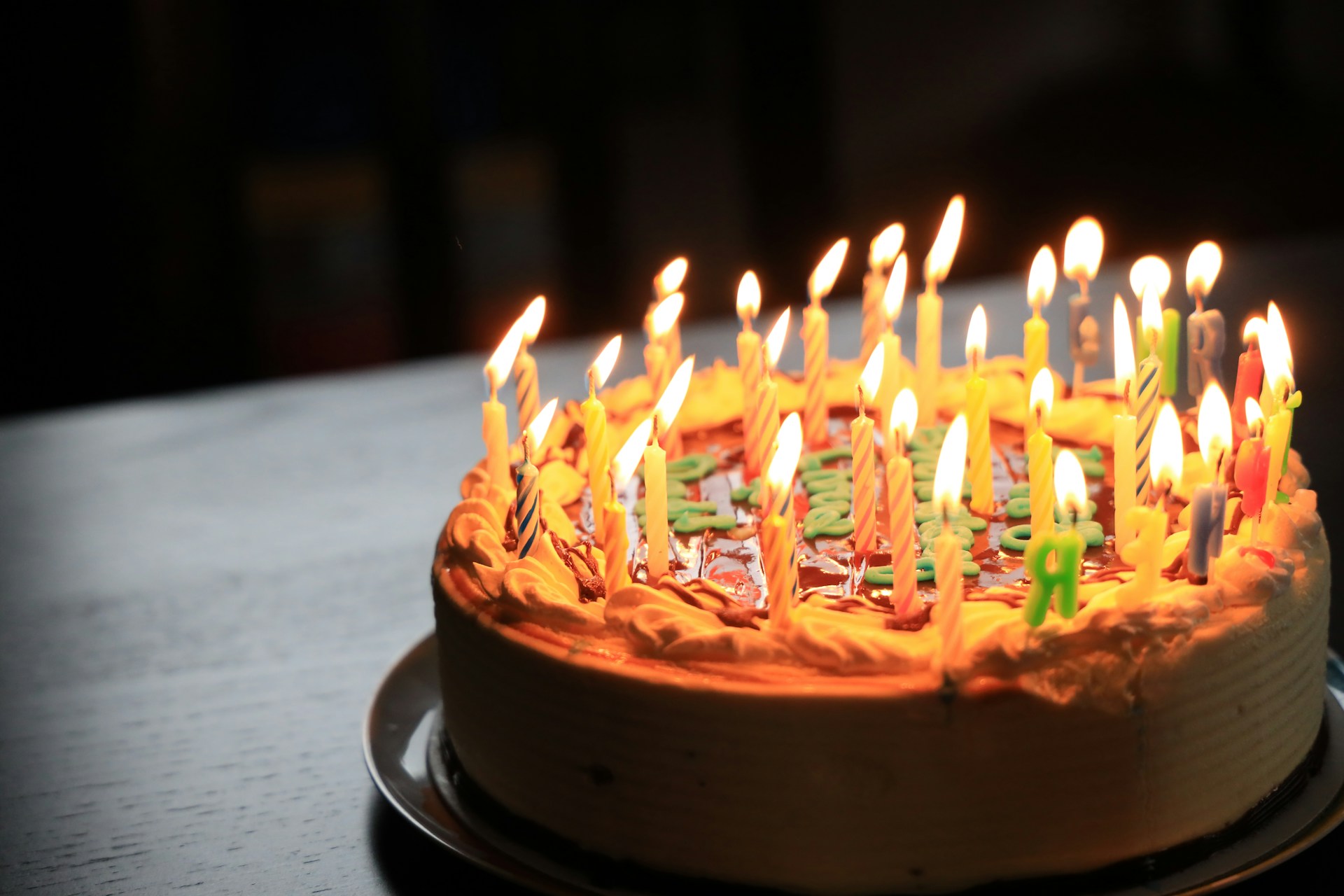 A birthday cake with many candles