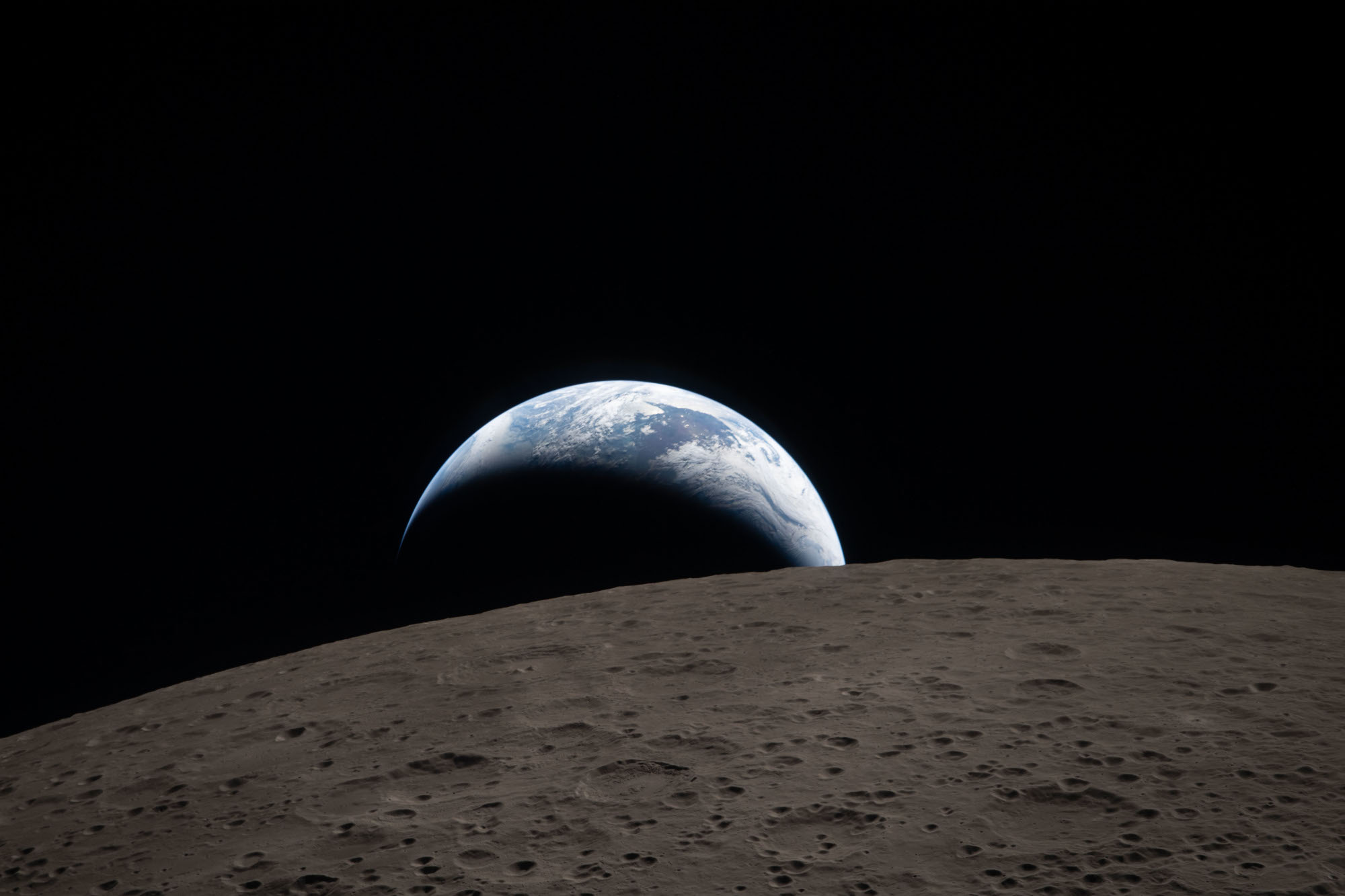 "Earthset"—the Earth setting behind the moon, taken by the astronauts aboard Integrity during the Artemis II mission.